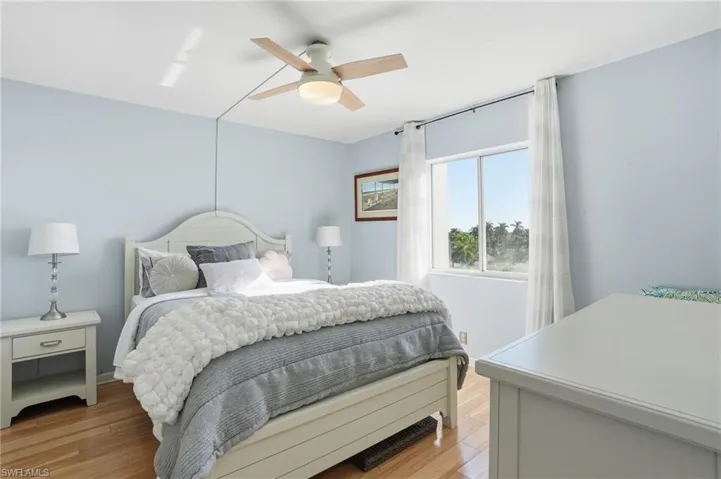Bedroom featuring a ceiling fan and light wood-style flooring