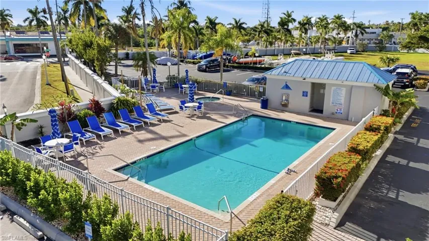 Community pool with a patio