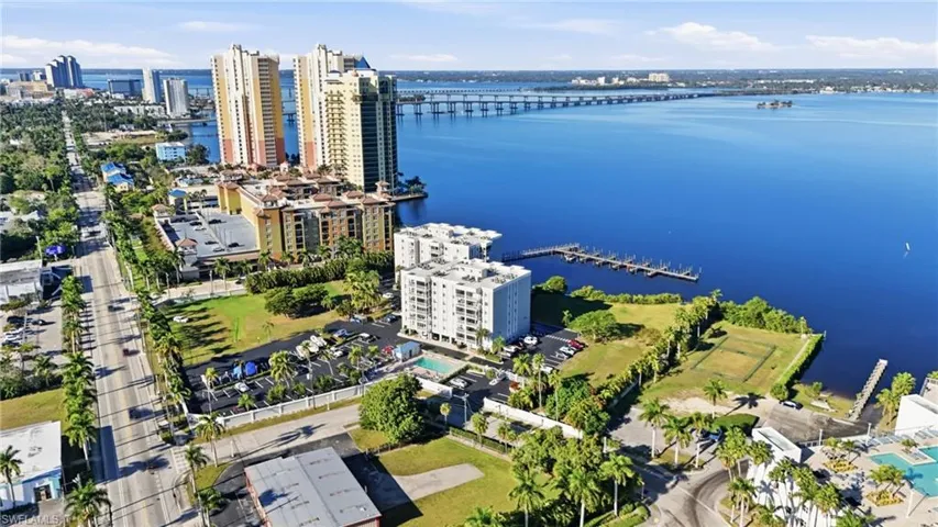 View of urban area featuring a nearby body of water and a notable bridge