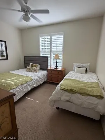 Bedroom featuring carpet flooring and a ceiling fan