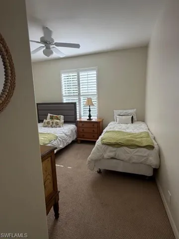Bedroom featuring carpet and ceiling fan