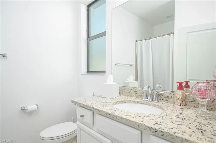 Bathroom with vanity and toilet