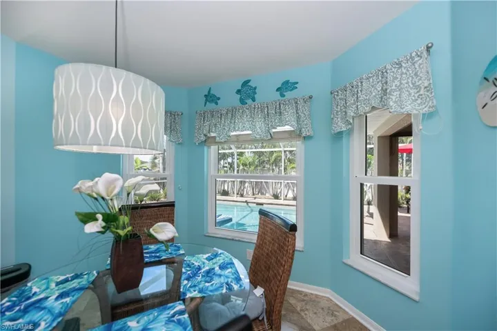 eat in kitchen area looking out to the pool and lanai