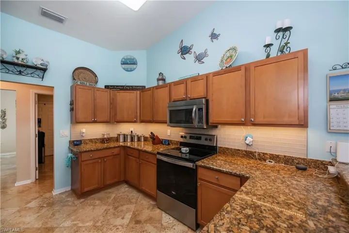 kitchen looking towards the hallway to dining room, laundry room & primary bedroom