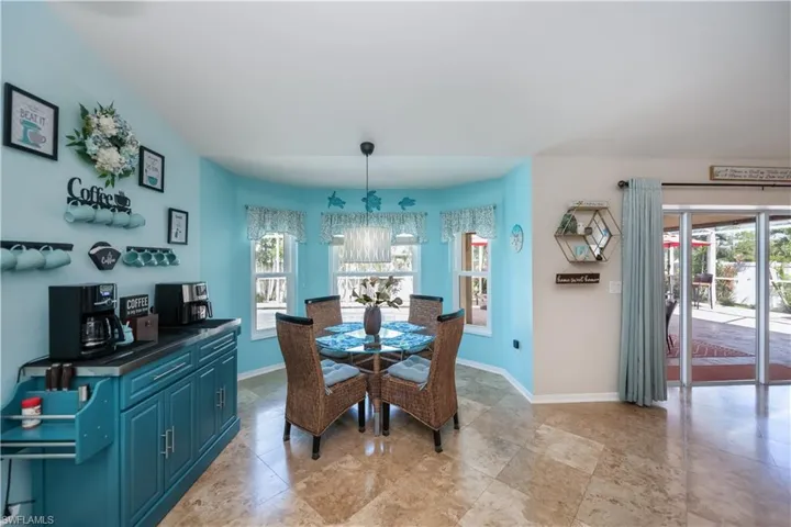 coffee bar and eat in kitchen area looking out to the pool