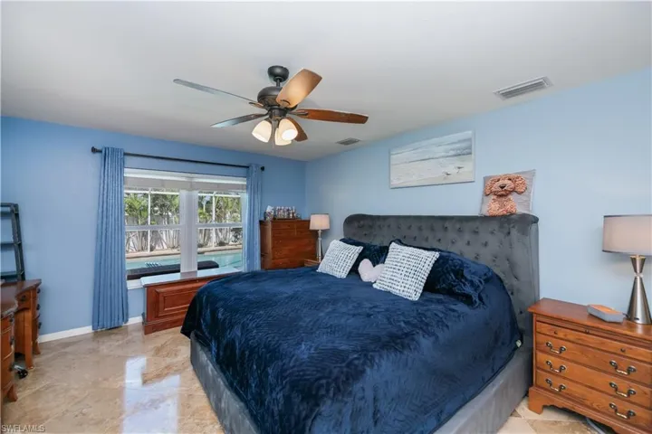 Master bedroom looking towards the pool and lanai area