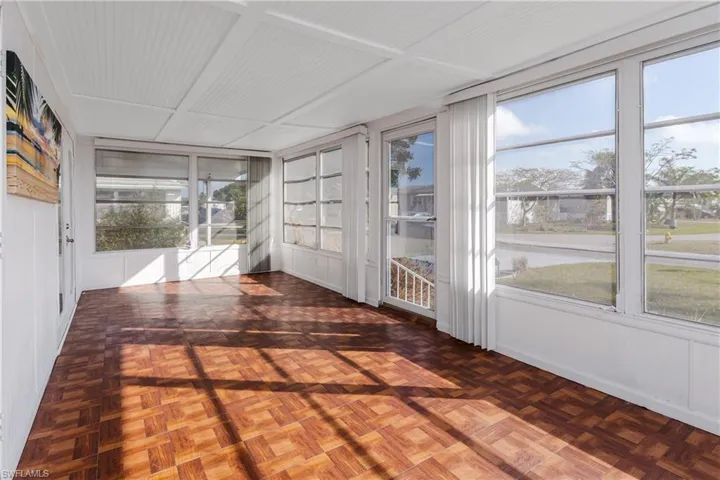 Unfurnished sunroom featuring plenty of natural light