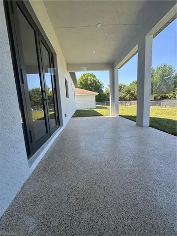 View of patio with fence