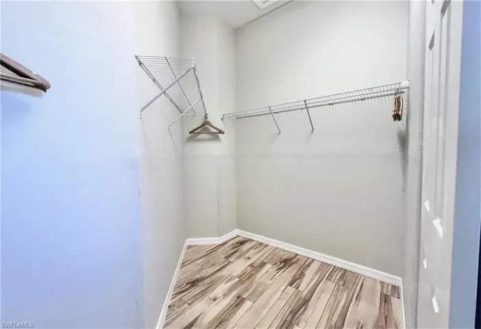 Walk in closet featuring light hardwood / wood-style floors