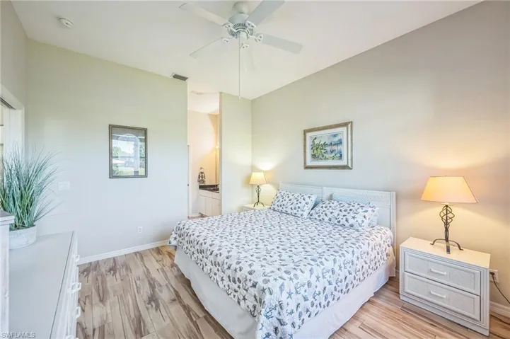 Bedroom featuring light hardwood / wood-style flooring and ceiling fan