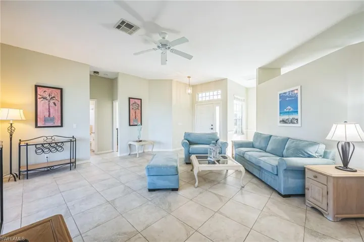 Tiled living room with ceiling fan