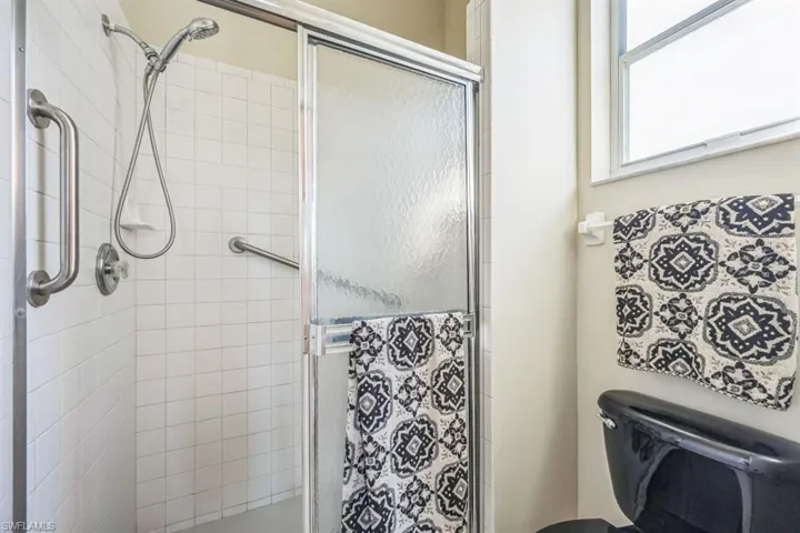 Bathroom with toilet and walk in shower