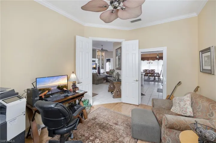 Office featuring crown molding and light wood-style floors