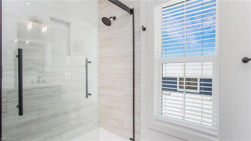 Bathroom featuring a shower stall