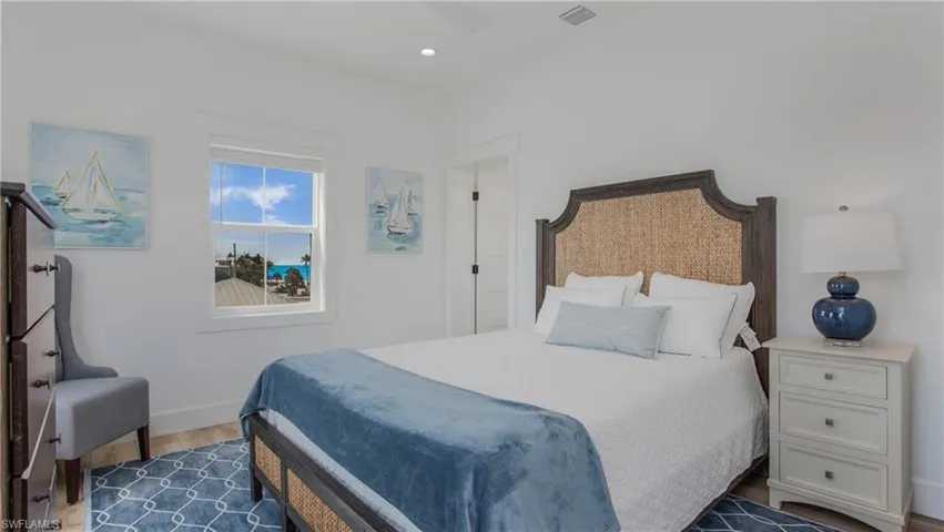 Bedroom featuring wood finished floors and recessed lighting