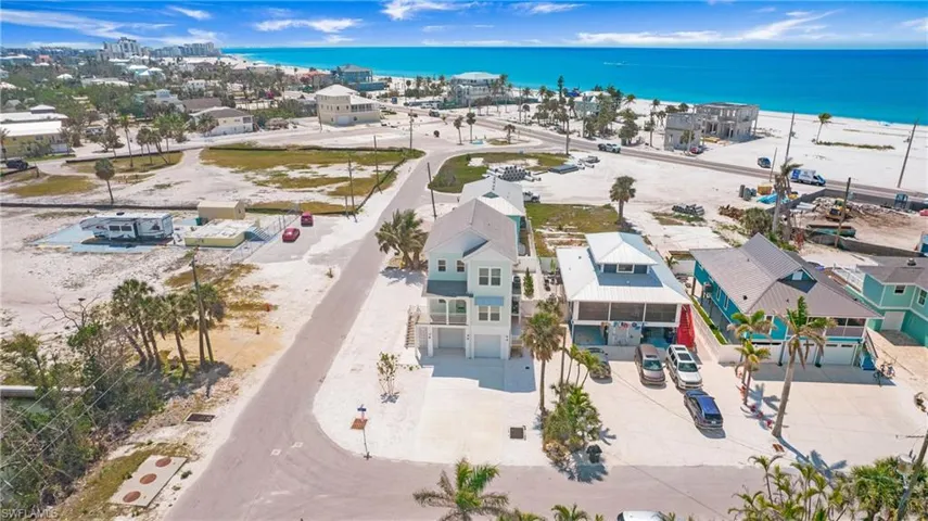 Drone / aerial view of waterfront with a beach