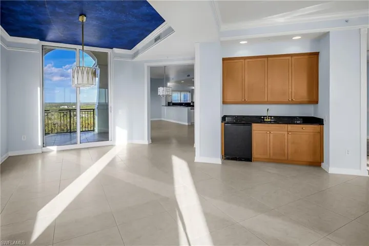 Alongside dining area and great room.