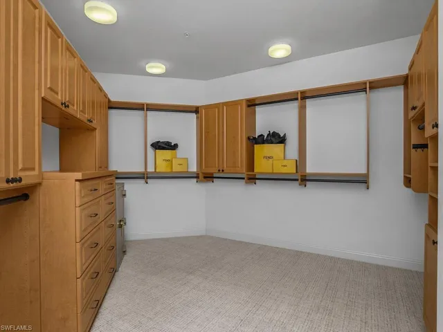 One of two sizable walk-in closets for main bedroom.