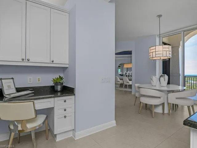 Office desk area adjacent to kitchen