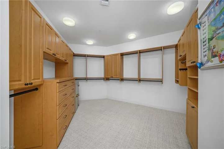One of two-walkin closetss for primary suite