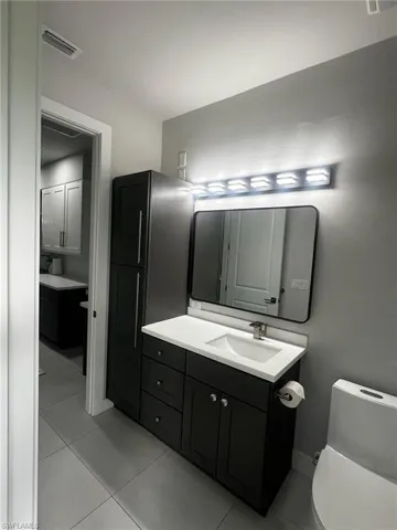 Bathroom featuring vanity and light tile patterned floors