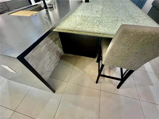 Dining area featuring light tile patterned floors