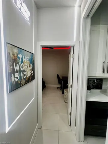 Corridor with light tile patterned floors