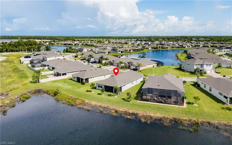 Aerial view of residential area with a large body of water
