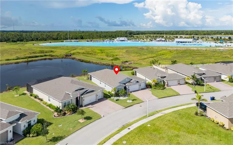 Aerial perspective of suburban area with a large body of water