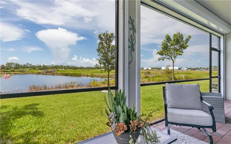 Sunroom / solarium with a water view