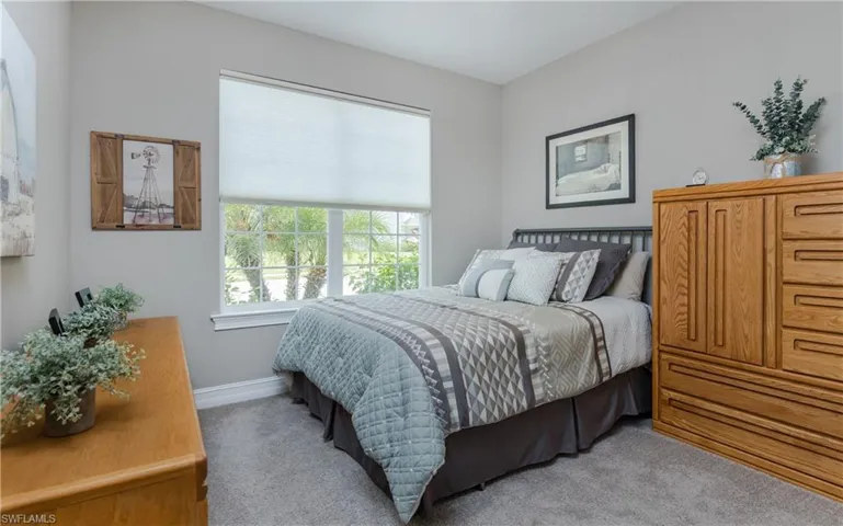 Bedroom with carpet and baseboards
