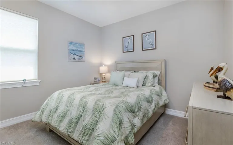 Bedroom with carpet and baseboards