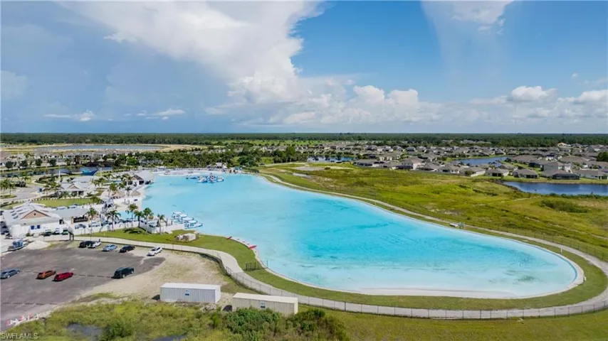 Aerial view of residential area featuring a large body of water