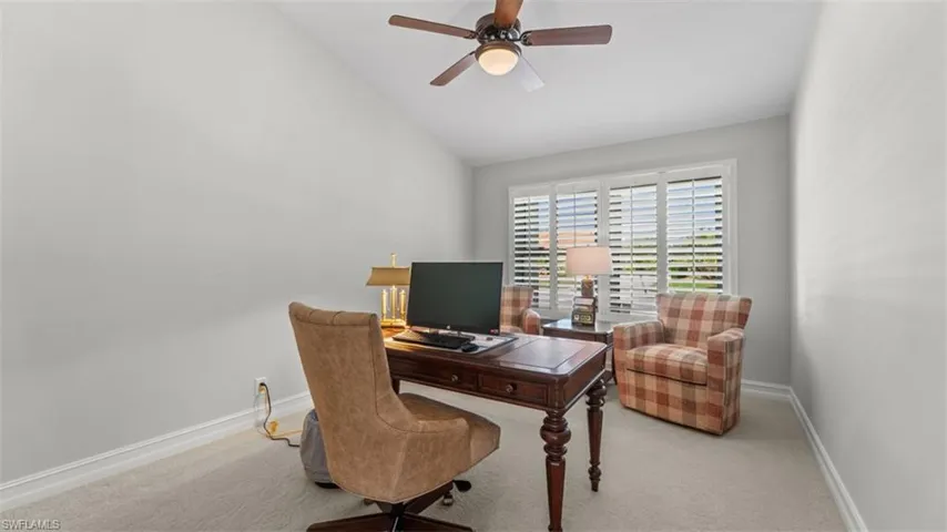 Office or 4th Bedroom, Vaulted ceiling with a ceiling fan, window with plantation shutters, light gray wall color, and white baseboards