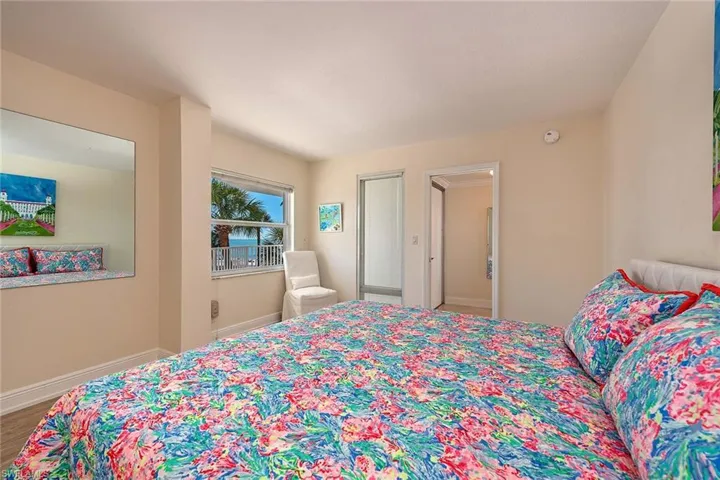 Bedroom featuring baseboards and wood finished floors