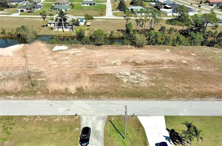 Aerial perspective of suburban area with a large body of water