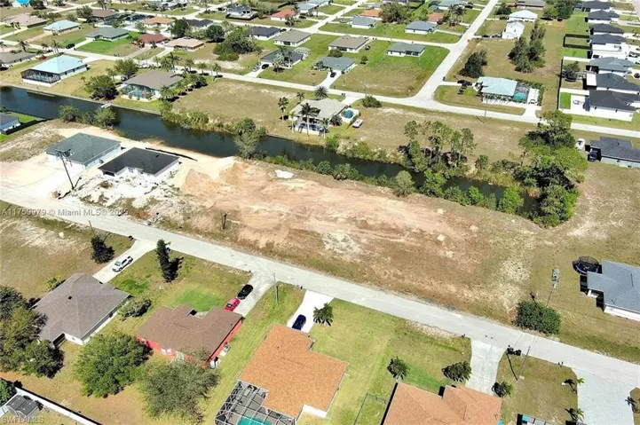 View of property location featuring nearby suburban area and a large body of water