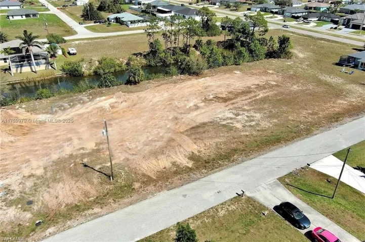 Aerial view of residential area with a nearby body of water