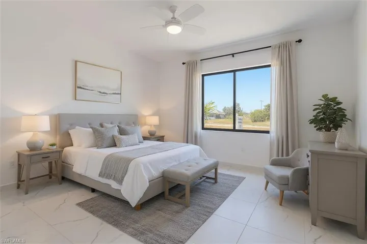 Bedroom with ceiling fan and light marble finish flooring