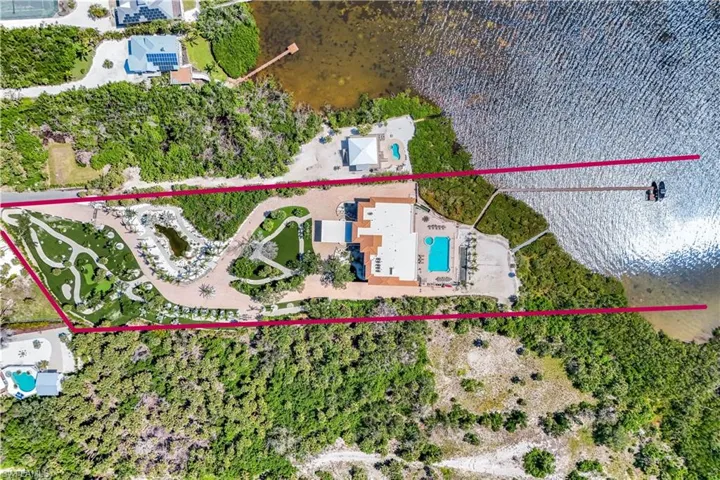 Aerial view of property's location featuring a pool area and property parcel outlined