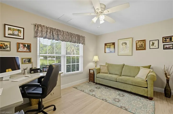 Office space featuring light wood-style floors and a ceiling fan