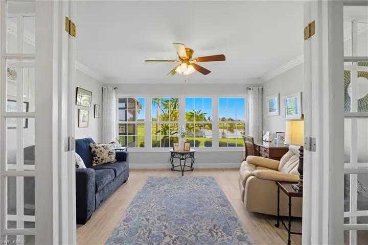 Sunroom / solarium featuring french doors