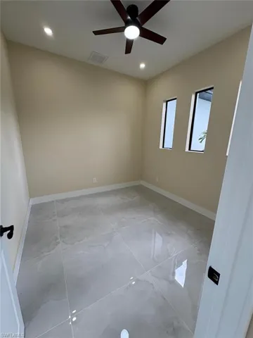 Empty room featuring recessed lighting and a ceiling fan