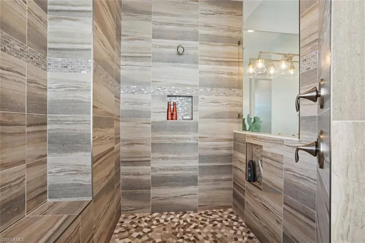 Spacious Shower with tile and multiple jets