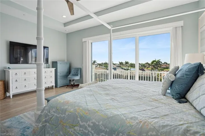 Master Bedroom featuring access to exterior balcony, recessed lighting, a ceiling fan, and LVF flooring