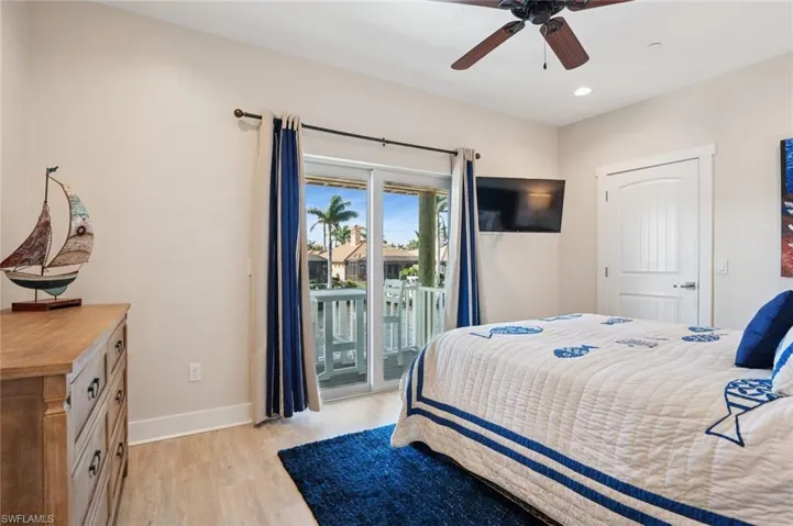 1st Bedroom featuring LVF floors, baseboards, recessed lighting, a ceiling fan, and access to balcony