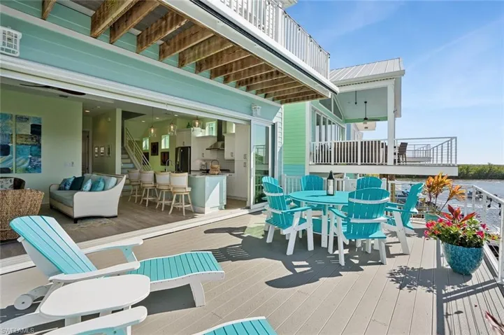 Composite entertaining deck featuring outdoor lounge & dining area