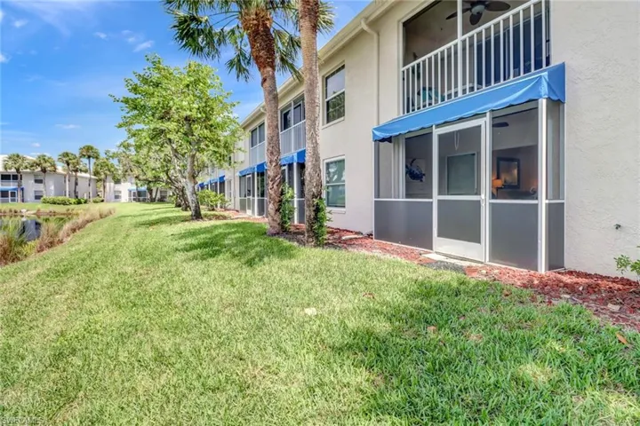 View of yard with a balcony