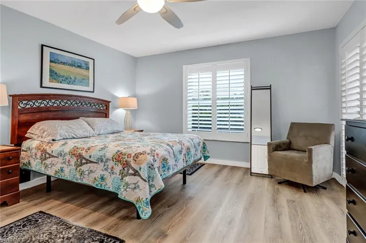 Bedroom featuring ceiling fan and light hardwood / wood-style floors