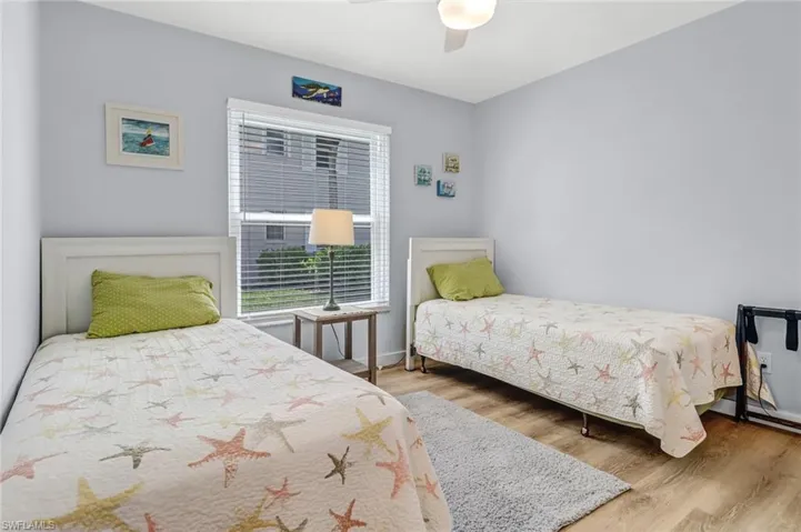 Bedroom with wood-type flooring and ceiling fan